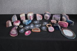 A collection of twelve geode pieces and other geode slices along with a geode hanging mobile. Some