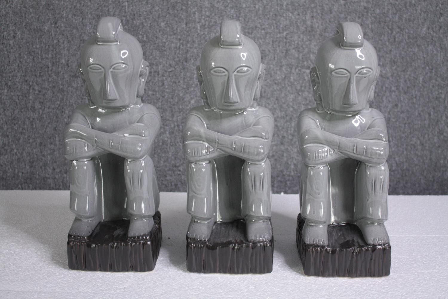 Three matching porcelain figures. H.36cm.(each)