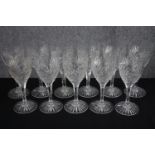 Eleven stemmed wine glasses. Cut crystal with star bases. H.20cm. (each)