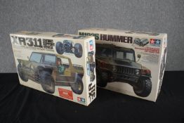 Tamiya. Model cars. The XR311 Combat Support Vehicle and the M1025 Hummer. Unmade 1/12 scale kits.