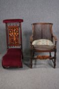 A 19th century mahogany prie dieu chair and a mid century Jacobean style oak armchair.