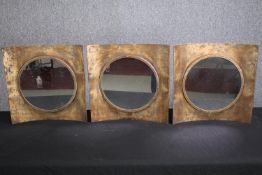 A set of three contemporary metal framed convex mirrors. H.40 W.40cm. (each)