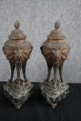 A pair of lidded bronze urns with covers. H.31cm. (each)