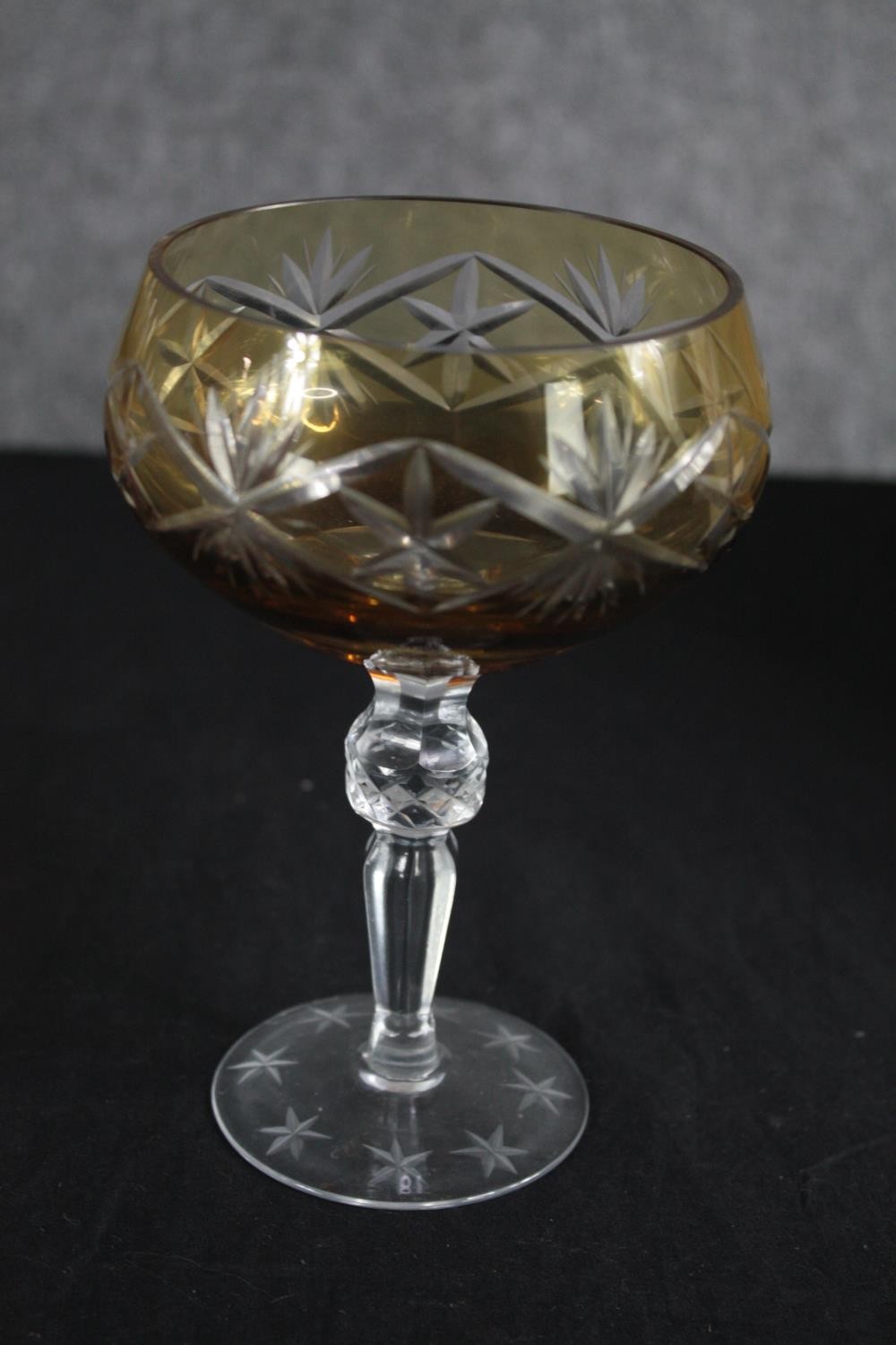 A set of six amber cut to clear stemmed wine glasses with star design. H.16cm. (each) - Image 2 of 3