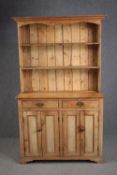 Kitchen dresser, C.1900 pine in two sections. H.162 W.113 D.45cm.