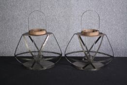 Two metal candleholders. H.49cm.(each).