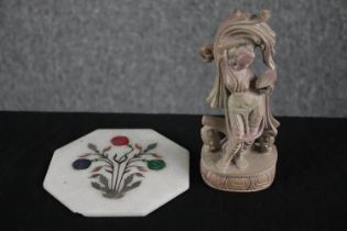 An Indian carved sandstone figure of an Indian deity along with a pietra dura coaster with floral