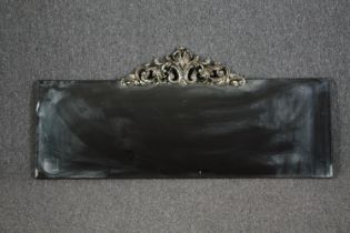 Wall mirror, contemporary bevelled glass with Rococo style cresting. H.54 W.120cm.