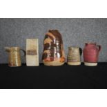 A mixed collection of pottery. Three jugs and two pots. Signed 'O.E.F' and Stephen Llewellyn Pottery