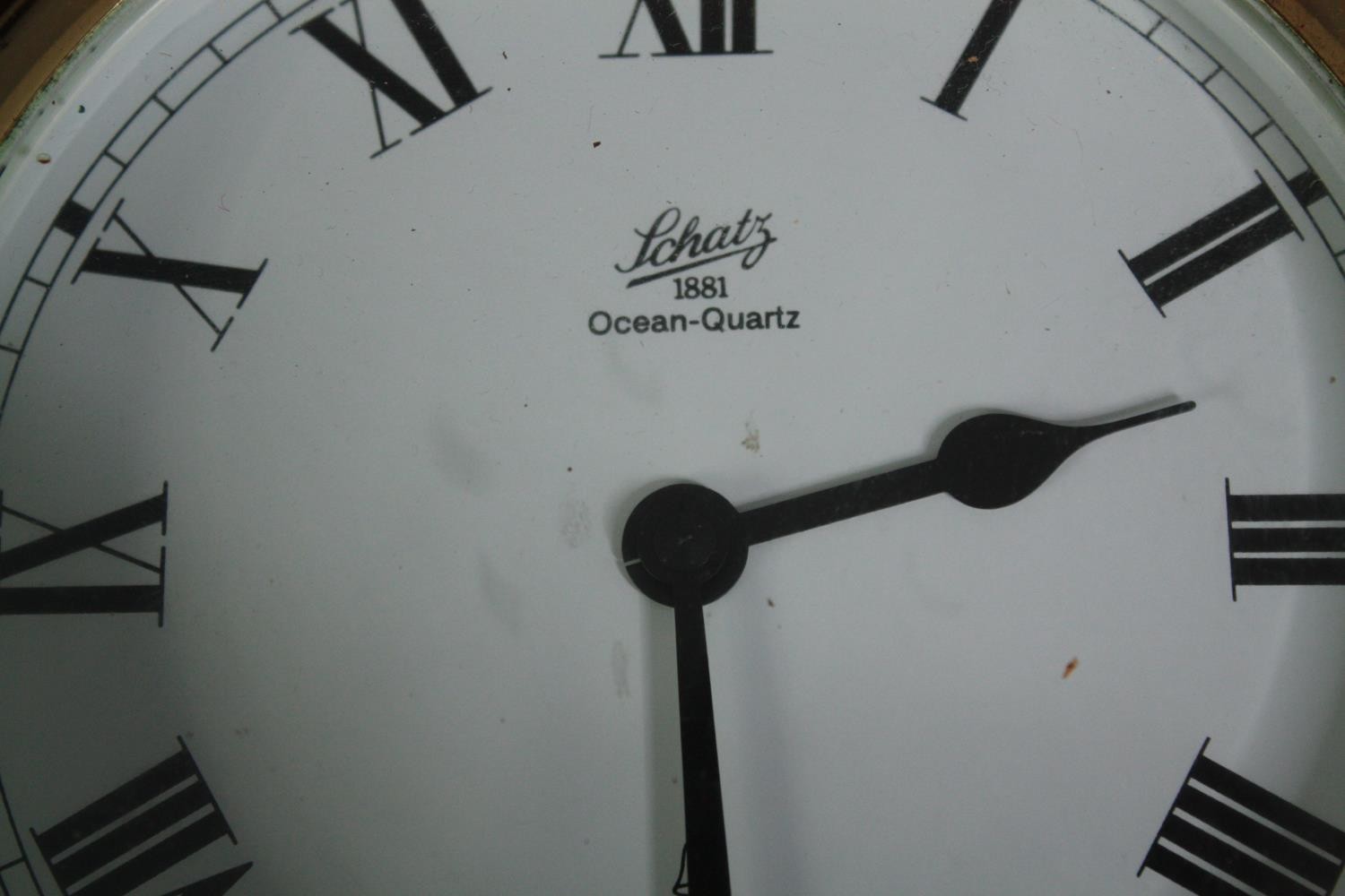 A brass cased Schatz clock with a bell mounted above. Ocean Quartz. H.42 W.22cm. - Image 3 of 5