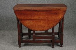 Dining table, 18th century oak with drop flap gateleg action. H.70 W.108 D.89cm. (extended)