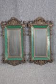 Mirrors, pair, C.1900 Baroque scrolling gilt metal frames with original bevelled plates. H.76 W.