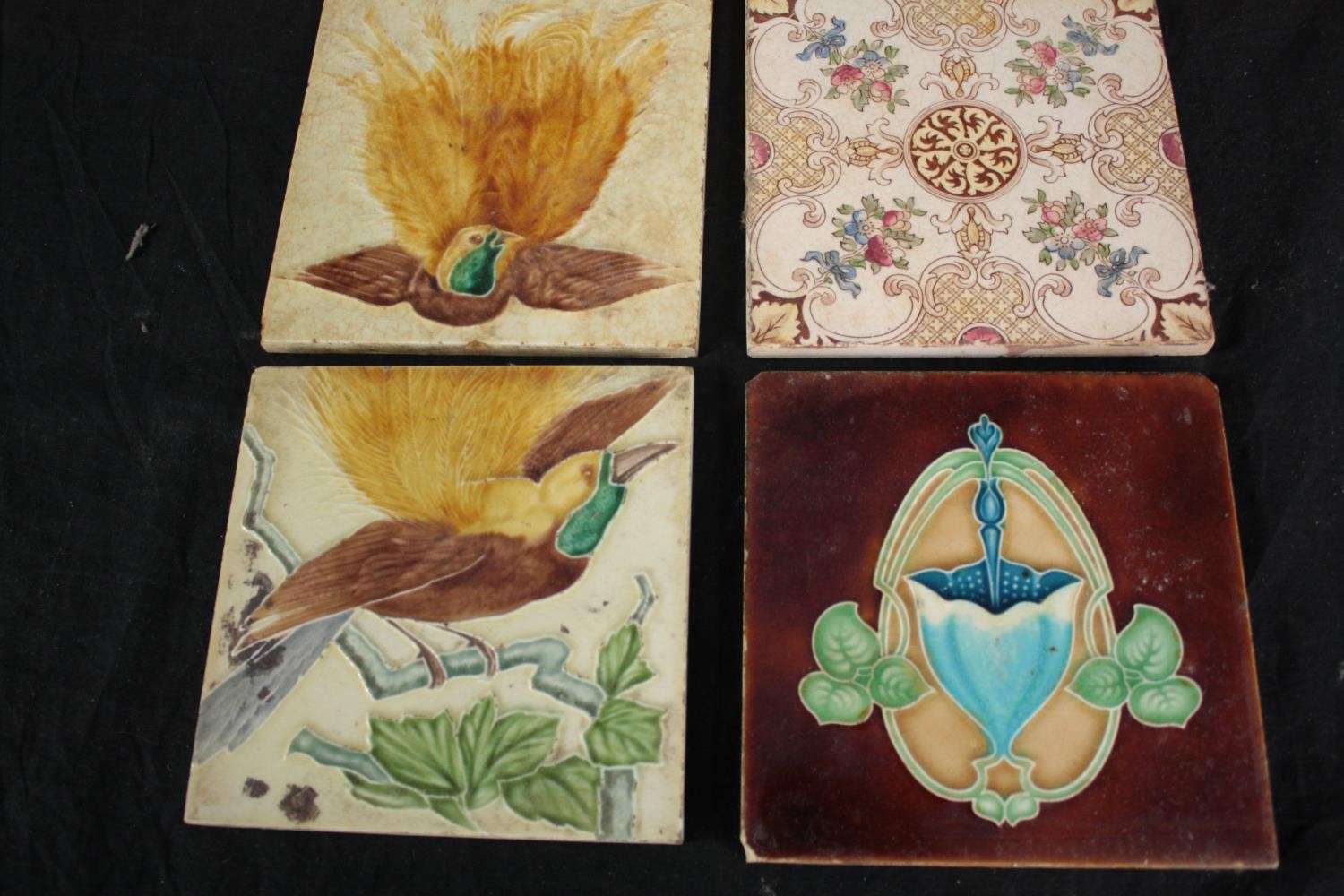 A mixed collection of twelve tiles. Including Art Nouveau and Majolica designs. H.15.5 W.15.5cm. - Image 4 of 5