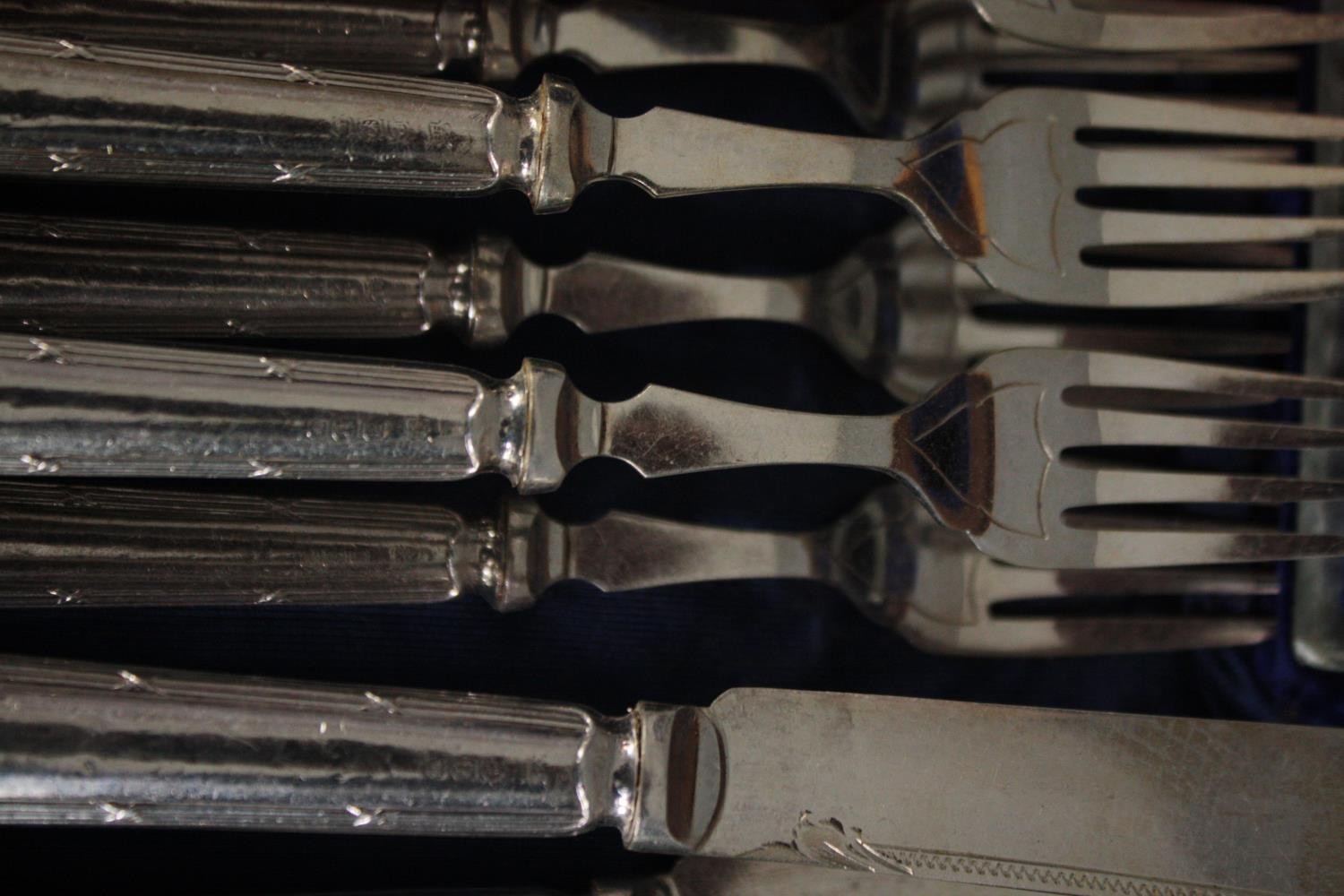 A complete Victorian mahogany canteen of silver plate cutlery for twelve people. The handles with - Image 6 of 6