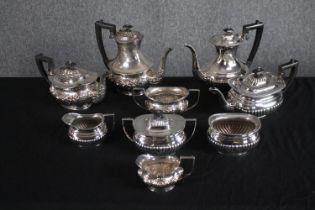 A silver plated collection of coffee and tea pots with creamers and sugar bowls. H.23cm (largest)