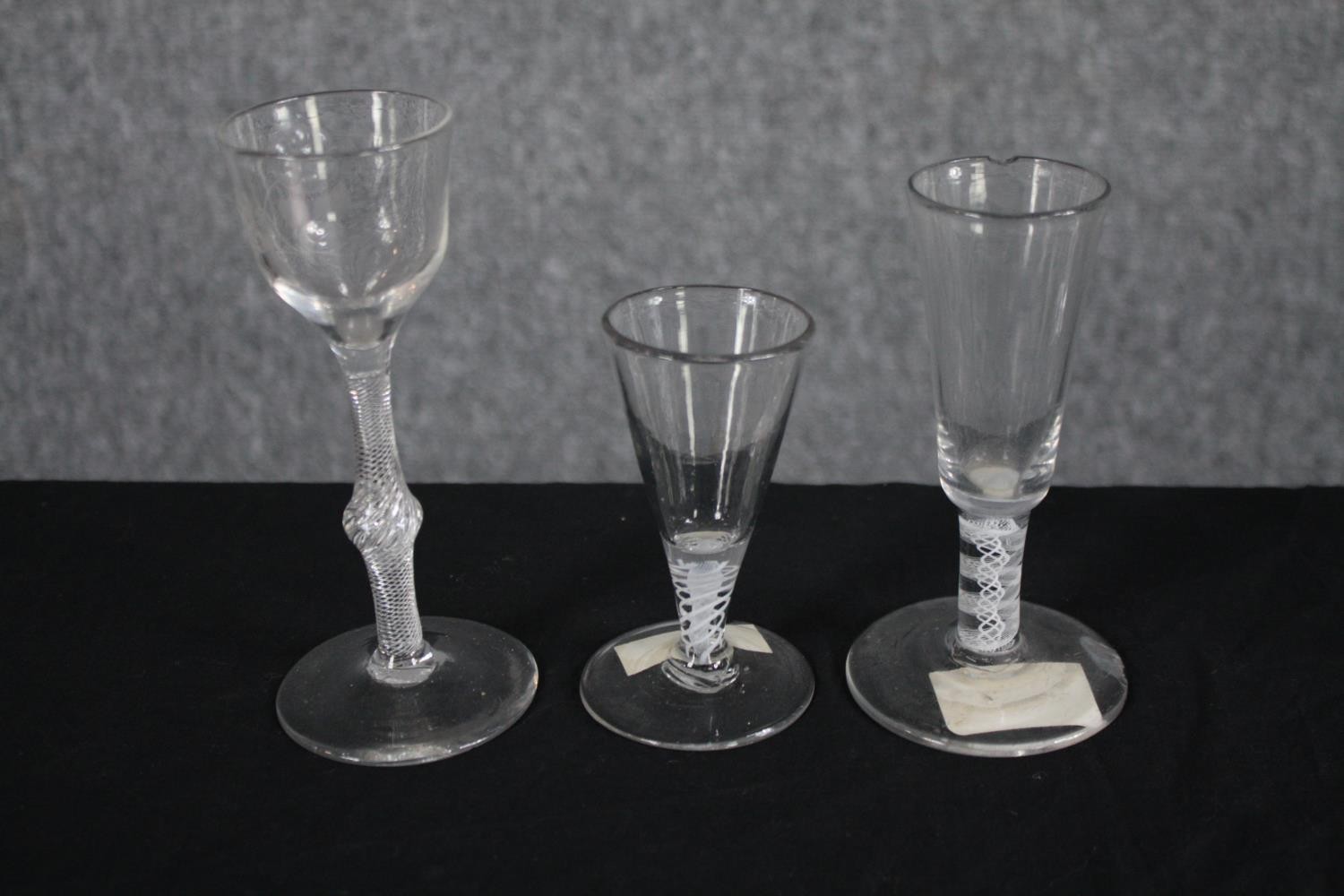 A mixed collection of six 18th and 19th century air twist stem wine glasses. One with a royal blue - Image 2 of 3