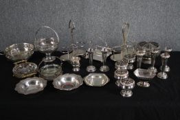 A mixed collection of silver plated cruet holders, rose bowls, and baskets. Various makers. Dia.