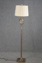 A standard floor lamp. A modern reproduction. H.152cm.