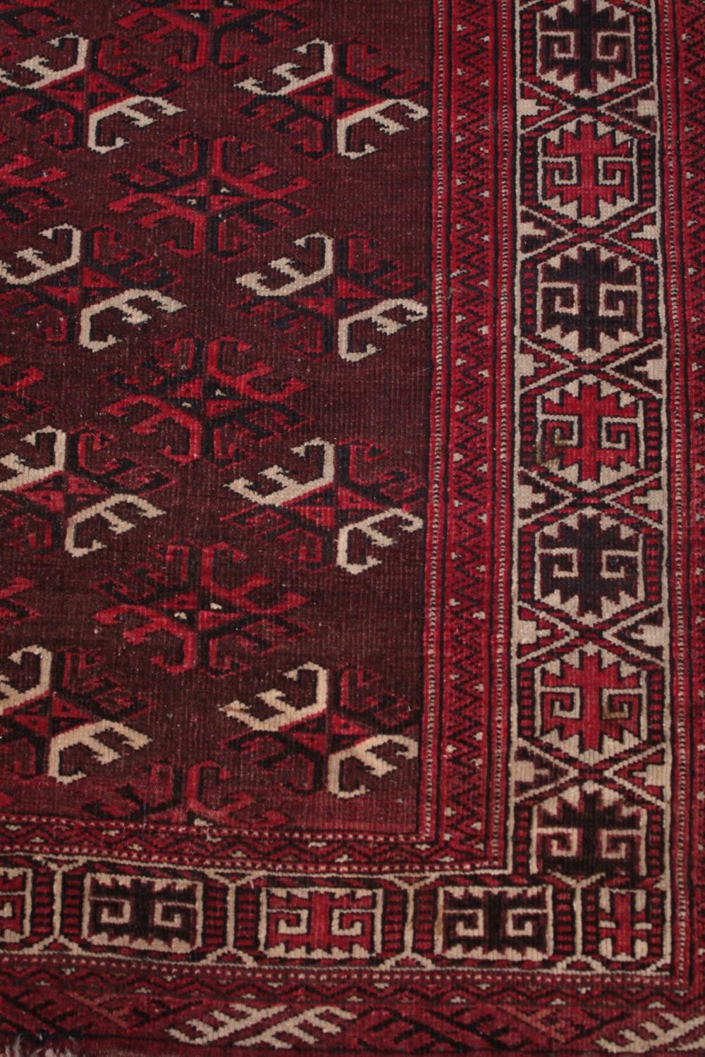 Rug, Belouch with repeating stylised motifs on a burgundy ground within multiple borders. L.167 W. - Image 3 of 4