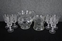 Six sherry glasses and and two jugs. H.16cm. (largest)