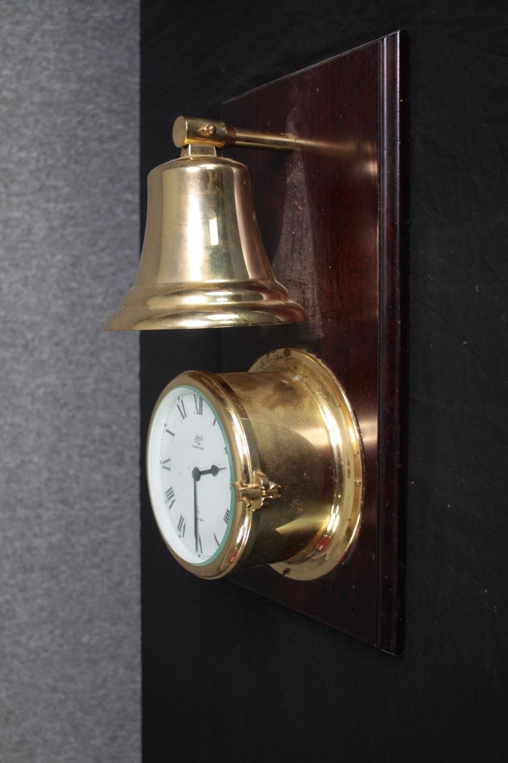 A brass cased Schatz clock with a bell mounted above. Ocean Quartz. H.42 W.22cm. - Image 5 of 5