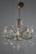 A small French chandelier with five brass branches and crystal drop detailing. H.43 Dia.50cm.