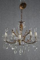 A small French chandelier with five brass branches and crystal drop detailing. H.43 Dia.50cm.