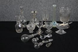 A assortment of 19th century glassware including decanters with their stoppers, glasses, rummers and