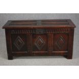 Coffer, 18th century carved panelled oak on stile supports. H.58 W.98 D.43cm.