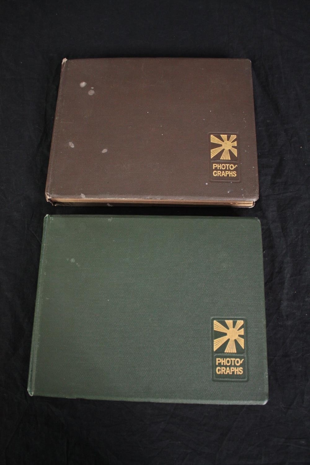 Two Ghanaian photograph albums of tribal communities, tribal art, animals and flora. Dated