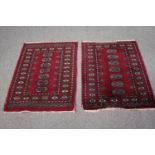 Two small Bokhara style rugs. L.92 W.67cm. (each)