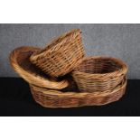 A collection of four wicker baskets. L.50cm.(largest)