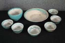 A collection of seven glazed bowls in a greenish teal. Dia.23cm. (largest)