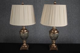 A pair of decorative table lamps. Painted turned wood with gadrooned glass bowls. H.64cm. (each)