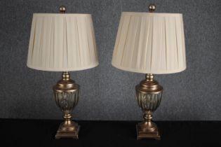 A pair of decorative table lamps. Painted turned wood with gadrooned glass bowls. H.64cm. (each)