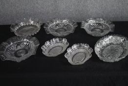 Seven glass bowls with etched decoration. Dia.28cm. (largest)