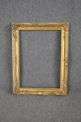 A 19th century giltwood and gesso picture frame. H.78 W.60cm.