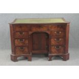 Kneehole desk, Georgian flame mahogany serpentine fronted with inset tooled leather top. H.83 W.