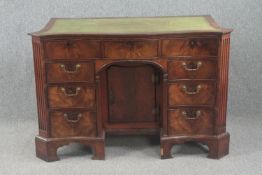 Kneehole desk, Georgian flame mahogany serpentine fronted with inset tooled leather top. H.83 W.
