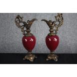 A matching pair of brass and porcelain ewers. Garniture in the style of Louis XV. H.30cm. (each)