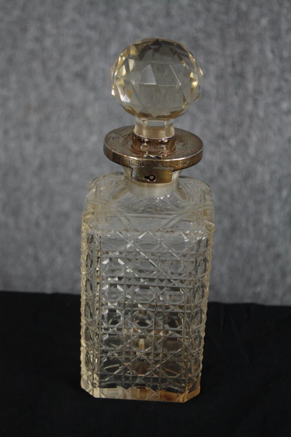 A rare antique cut glass decanter with silver Betjemann's patent lock. Missing its key but unlocked.