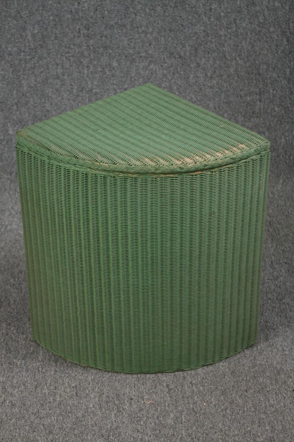 Lloyd Loom basket in light green with label.