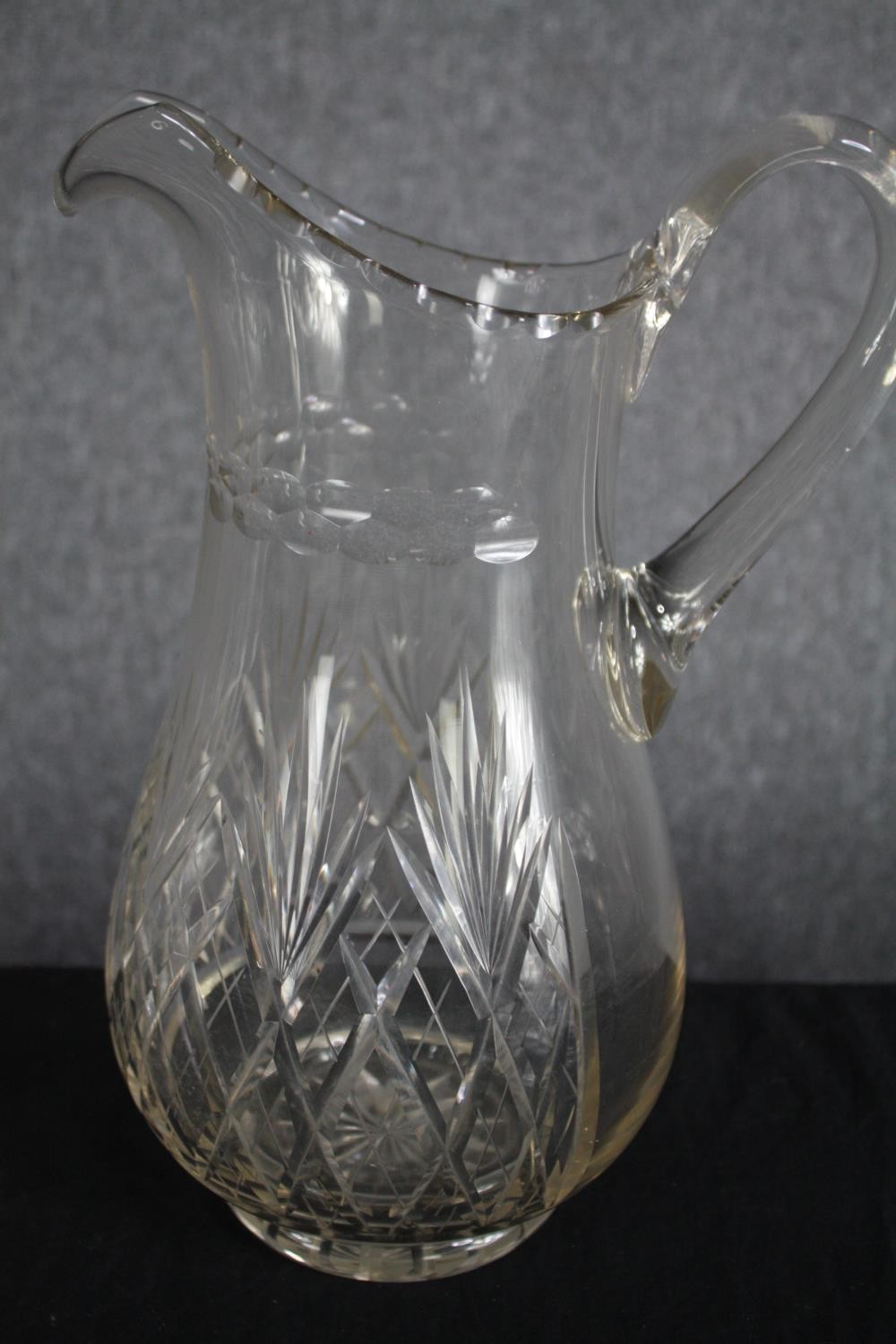 A mixed collection of four glass decanters and a jug. Cut glass and complete with their stoppers. - Image 4 of 4