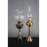 Two brass oil lamps. H.72cm. (largest)