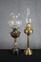 Two brass oil lamps. H.72cm. (largest)