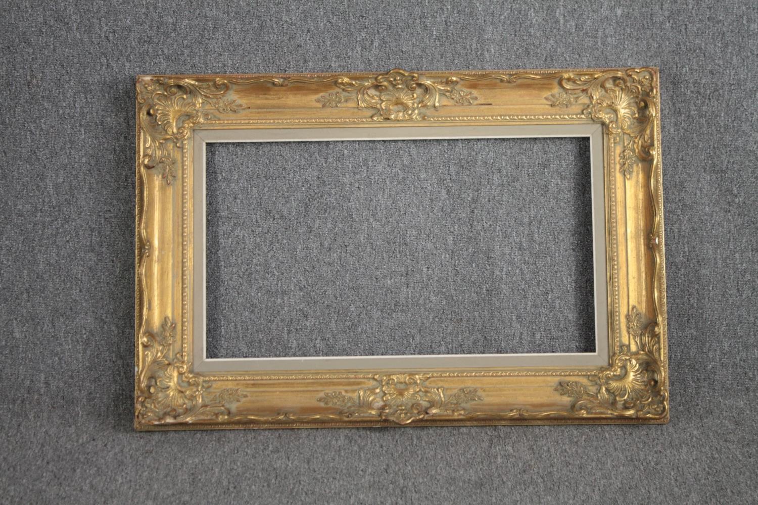 A giltwood and gesso picture frame. H.92 W.117cm.