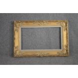 A giltwood and gesso picture frame. H.92 W.117cm.