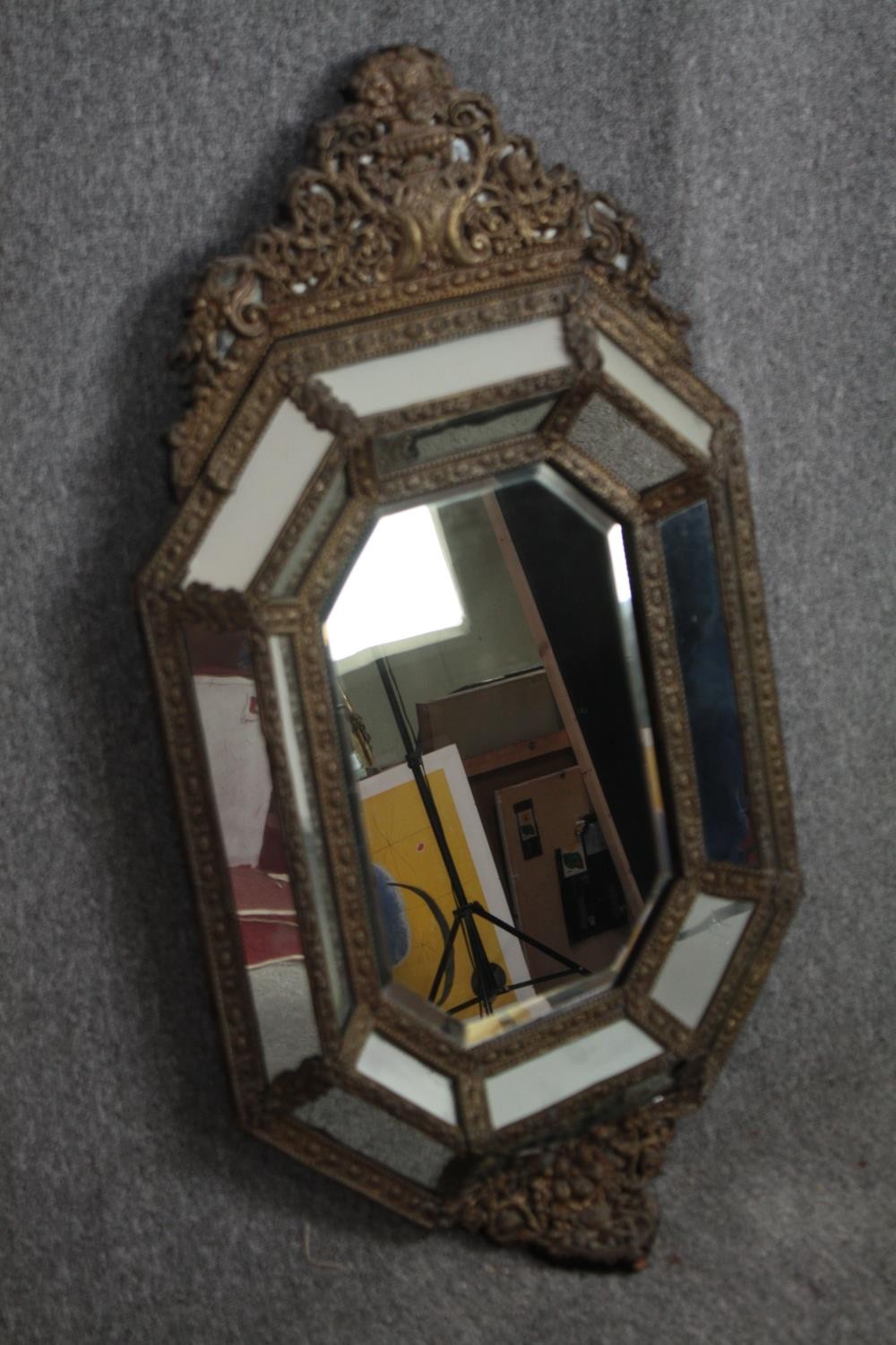 Wall mirror, C.1900 Dutch style in repousse metal cushion frame. H.109 W.62cm. - Image 2 of 5