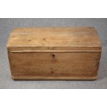 A 19th century pine domed top coffer. H.47 W.92 W.48cm.