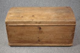 A 19th century pine domed top coffer. H.47 W.92 W.48cm.